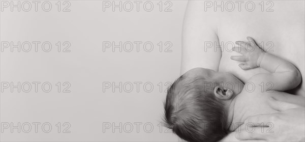 Woman breastfeeding a boy