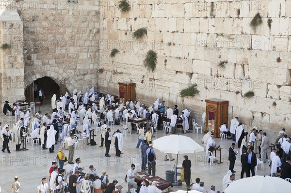 Jewish men praying at the Wailing Wall