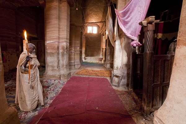 Orthodox monk in the rock-hewn church of Mikael Imba