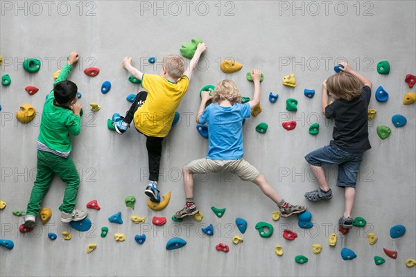 Children climbing on a climbing wall