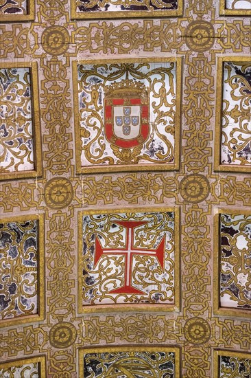 Hall with a coffered ceiling and historical shields of Portugal