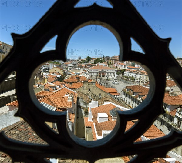 Outlook through a wrought iron grid of Santa Justa Elevator