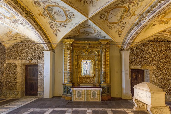 Stacked bones and skulls in the ossuary