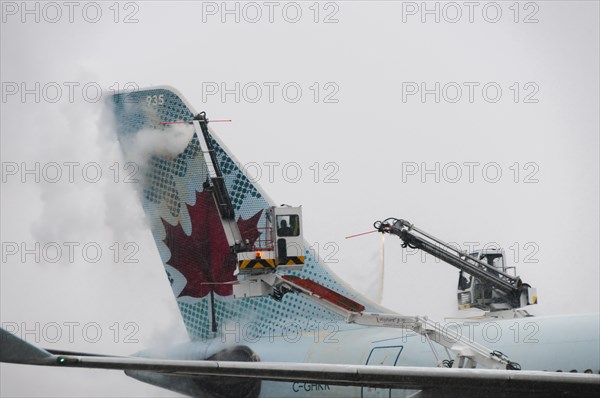 Tail of an Airbus A330-343x from Air Canada being de-iced at Frankfurt Airport