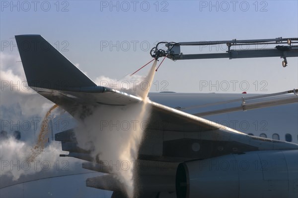 Wing and winglet of an Airbus A340 of Lufthansa airlines during de-icing at Frankfurt Airport