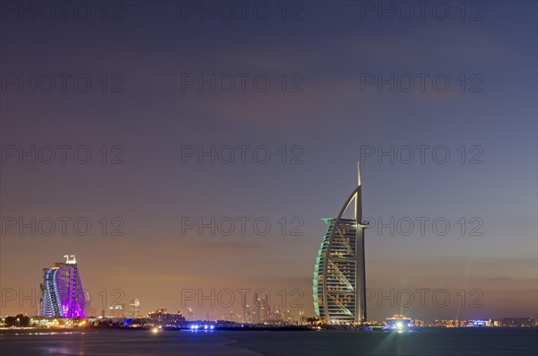 The luxury hotel Burj Al Arab off Jumeirah beach at dusk