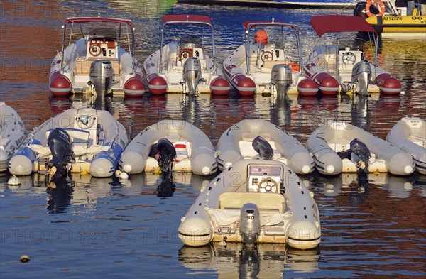 Inflatable boats with outboard motors in the harbor of Porto