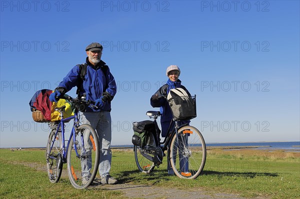 Bicyclists on a dyke