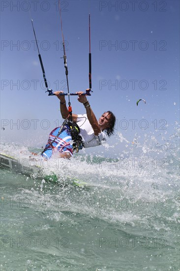 Kitesurfer in turquoise blue lagoon