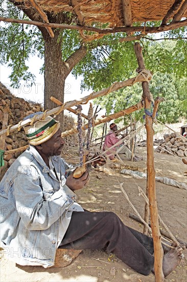 Man working on a loom