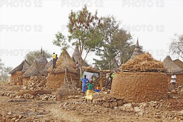 Men thatching the roof of a rondavel