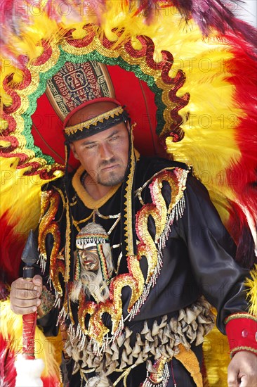 Man wearing a festive traditional Indio costume