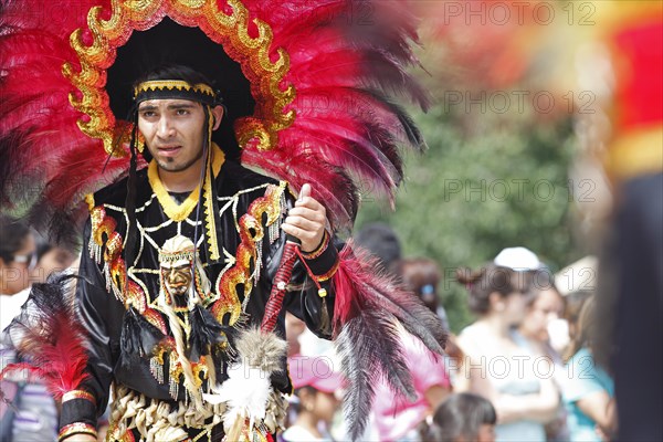 Man wearing a festive traditional Indio costume