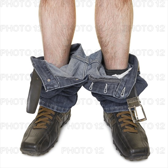 Man with his trousers around his ankles