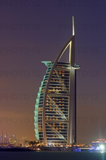 The luxury hotel Burj Al Arab off Jumeirah beach at dusk