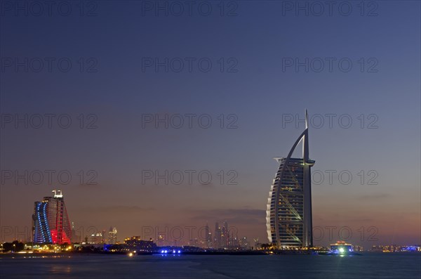 The luxury hotel Burj Al Arab off Jumeirah beach at dusk