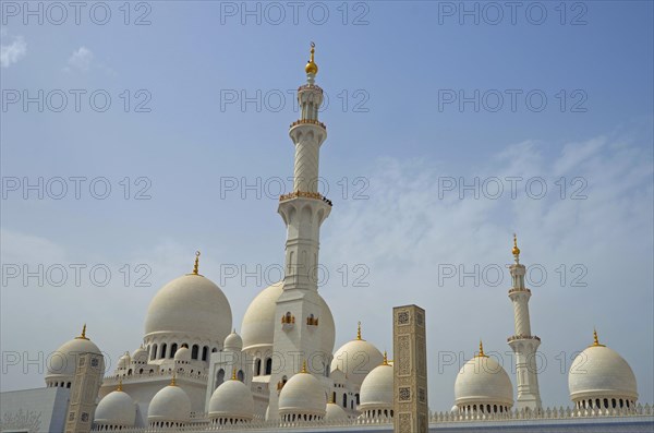 The white marble domes and minarets of Sheikh Zayed Grand Mosque