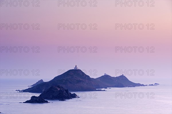 Les Iles Sanguinaires in the mediterranean sea at the blue hour after sunset seen from Tour de la Parata. Les Iles Sanguinaires are in the department Corse-du-Sud