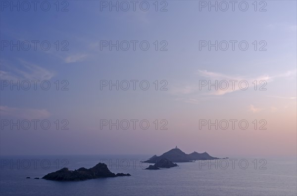 Les Iles Sanguinaires in the mediterranean sea at the blue hour after sunset seen from Tour de la Parata. Les Iles Sanguinaires are in the department Corse-du-Sud