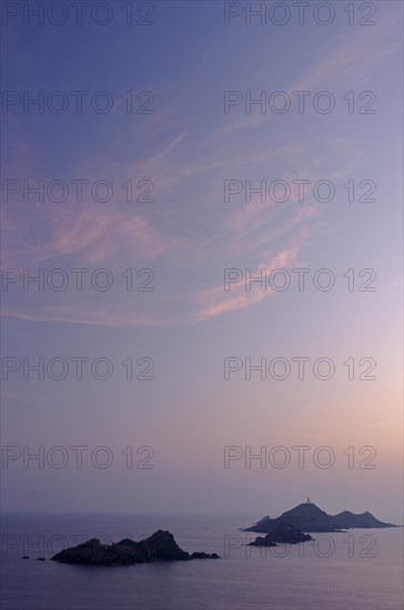 Les Iles Sanguinaires in the mediterranean sea at the blue hour after sunset seen from Tour de la Parata. Les Iles Sanguinaires are in the department Corse-du-Sud