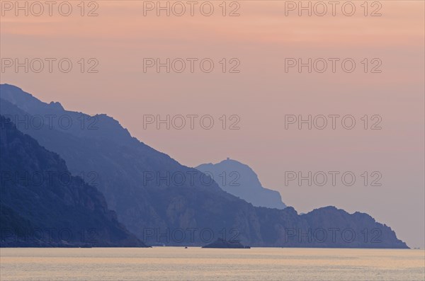 The Gulf of Porto with the surrounding mountains at sunset