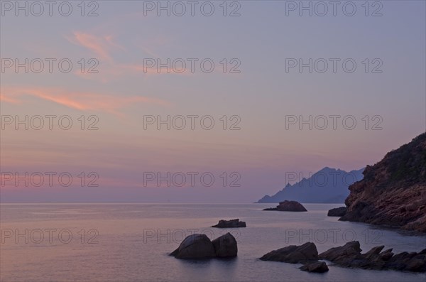 The Gulf of Porto with the surrounding mountains at sunset