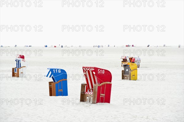 Colourful roofed wicker beach chairs on the beach