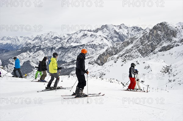 Skiers and mountain landscape at Mt Osterfelderkopf