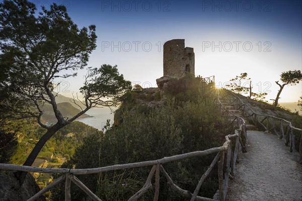 Old watchtower on the coast at sunset