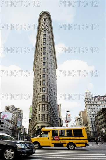 Broadway with a school bus and the Flatiron Building