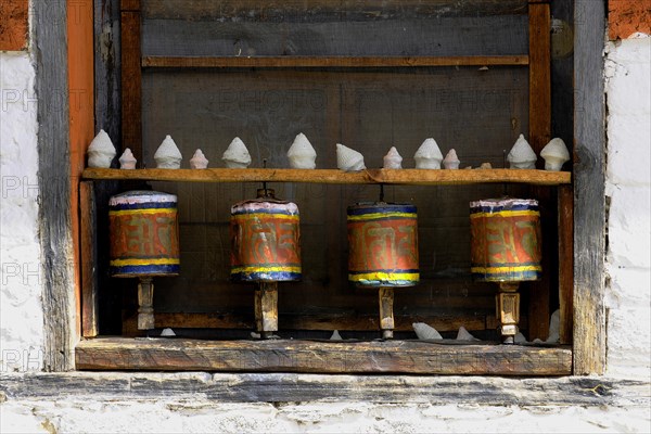 Prayer wheels in the outer wall of a temple