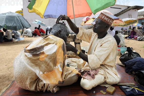 Barber at the market of Ngaoundere