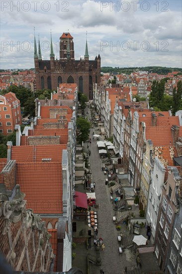 Overview of Mariacka Street or Ulica Mariacka with the historic patrician houses and St. Mary's Church