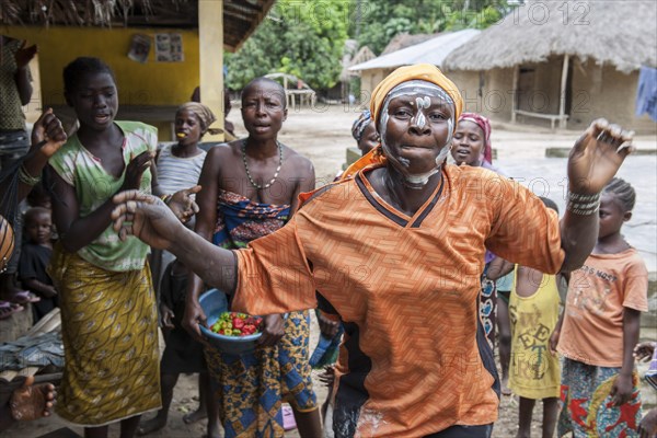 Villagers celebrating a festival with traditional dance and music