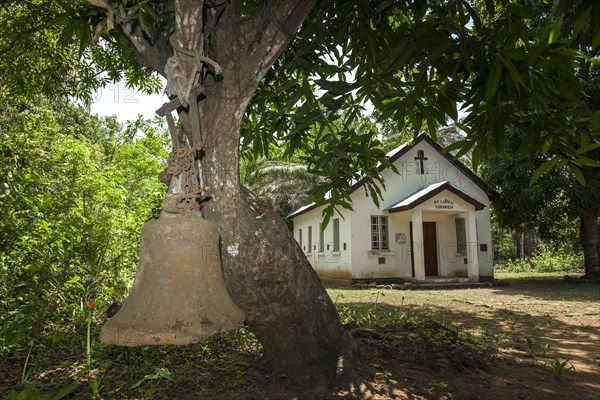 Old bell from the colonial period still used for calling the faithful to the Church of St. Luke