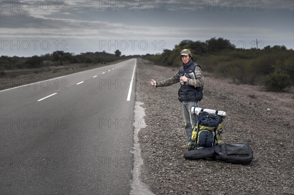 Hitchhiker standing by the roadside