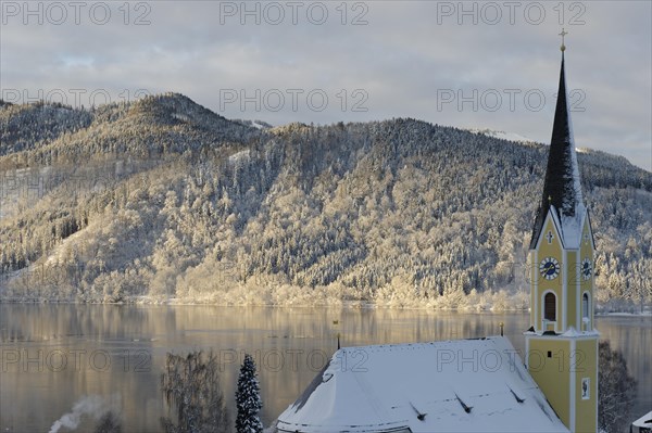 Lake Schliersee with the Church of St. Sixtus in winter