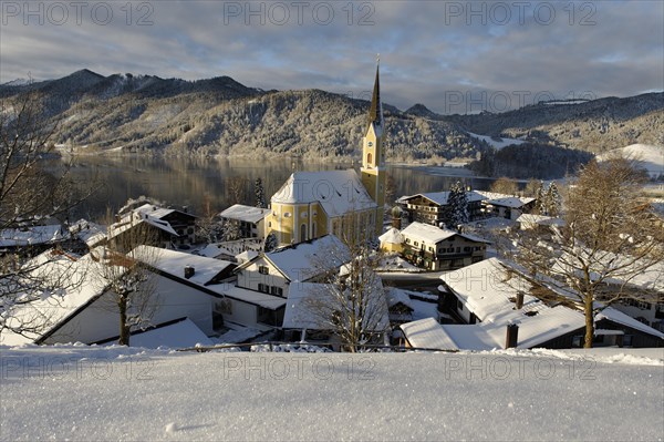 Lake Schliersee with the Church of St. Sixtus in winter