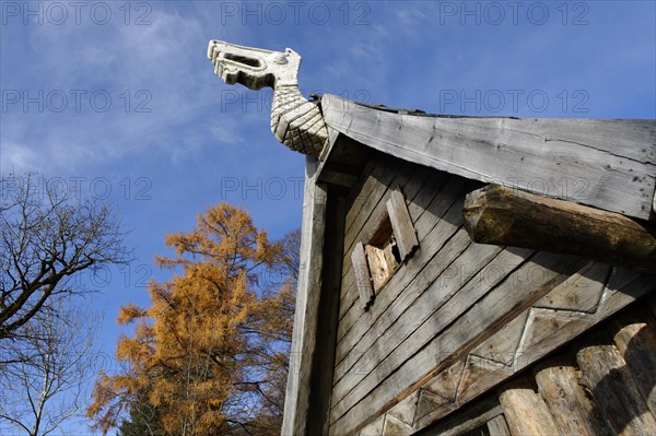 Dragon head as an ornament on a wooden hut