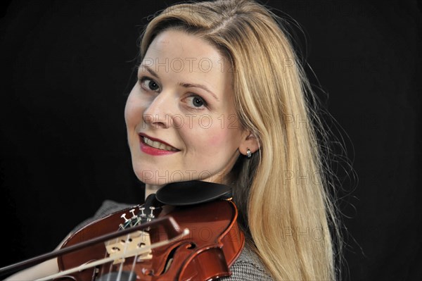 Young woman playing the violin