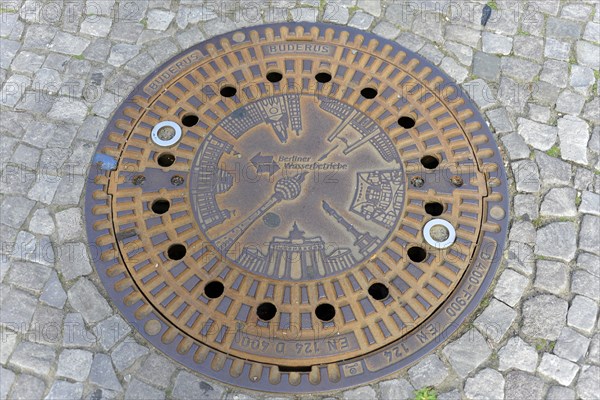 Berlin landmarks depicted on a manhole cover