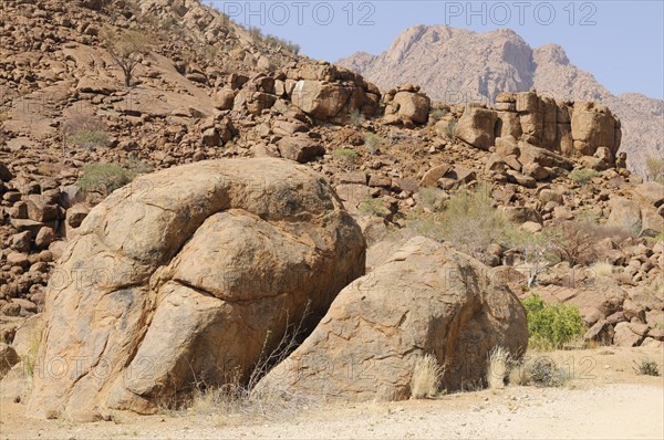 Mountain landscape along a trail to the White Lady rock painting in the Tsisab Gorge