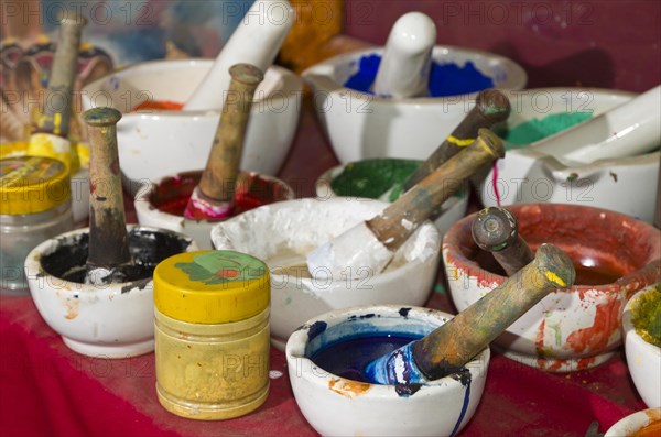 Different bowls with natural colors for painting Thangkas at an art school