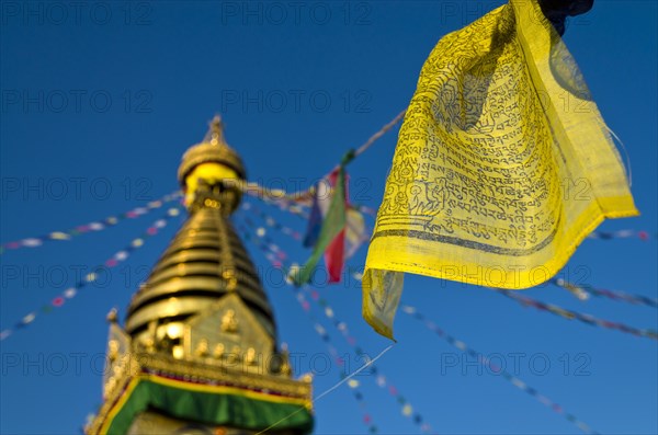 Yellow Buddhist prayer flag with Swayambhunath Stupa