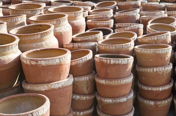 Newly made pottery drying in the sun