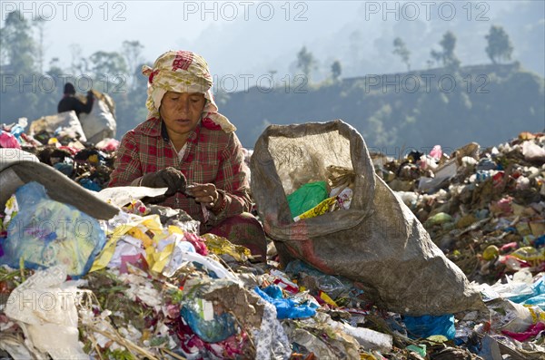 Woman sorting out garbage at Aletar garbage dump