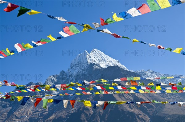 Buddhist prayer flags in front of Kangtega Mountain above Namche Bazar (3.440 m)