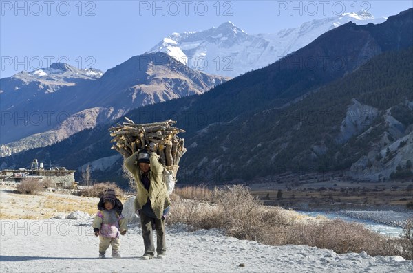 Woman walking with a small child