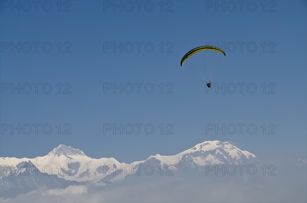 Paraglider sailing through the air