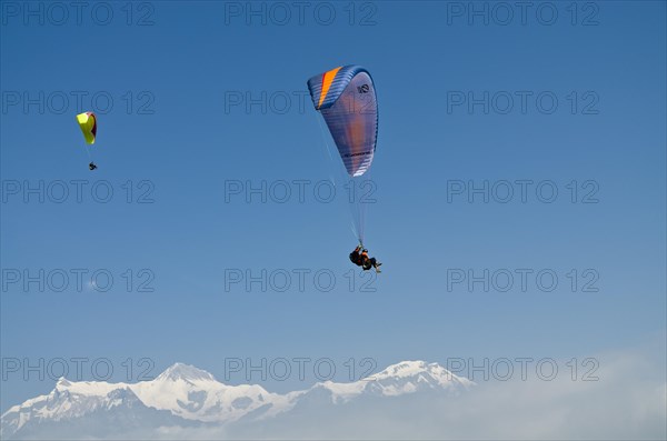 Paraglider sailing through the air